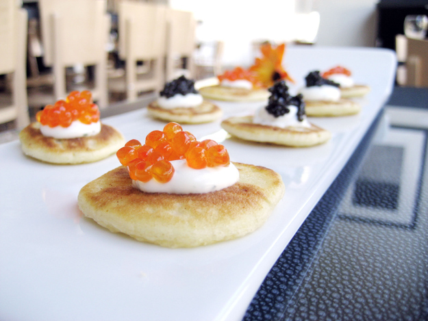 Blini with caviar and sour cream